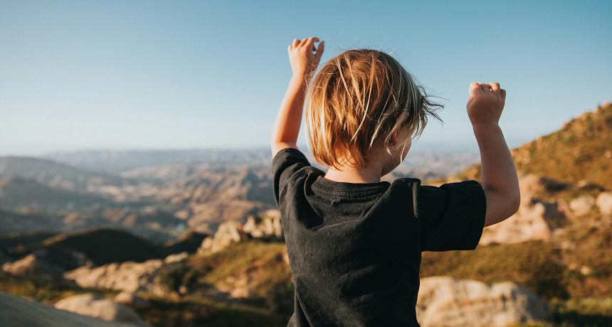 Child looking at mountains