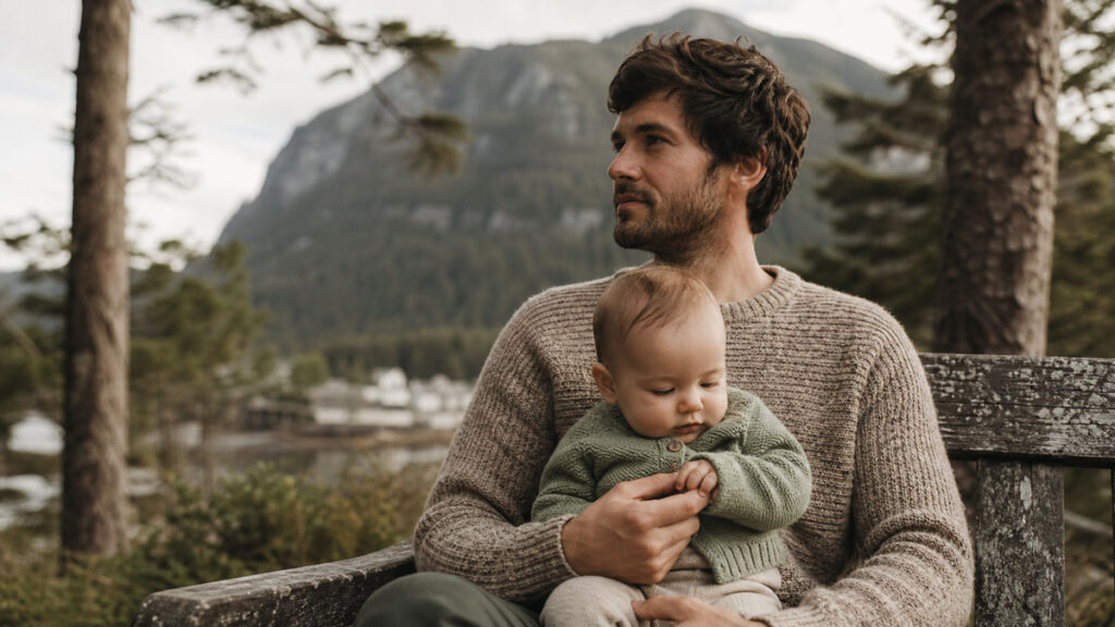 How Long Are Child Care Waitlists in Squamish? 2 Child care waitlist Squamish: a parent and infant outdoors below the mountains
